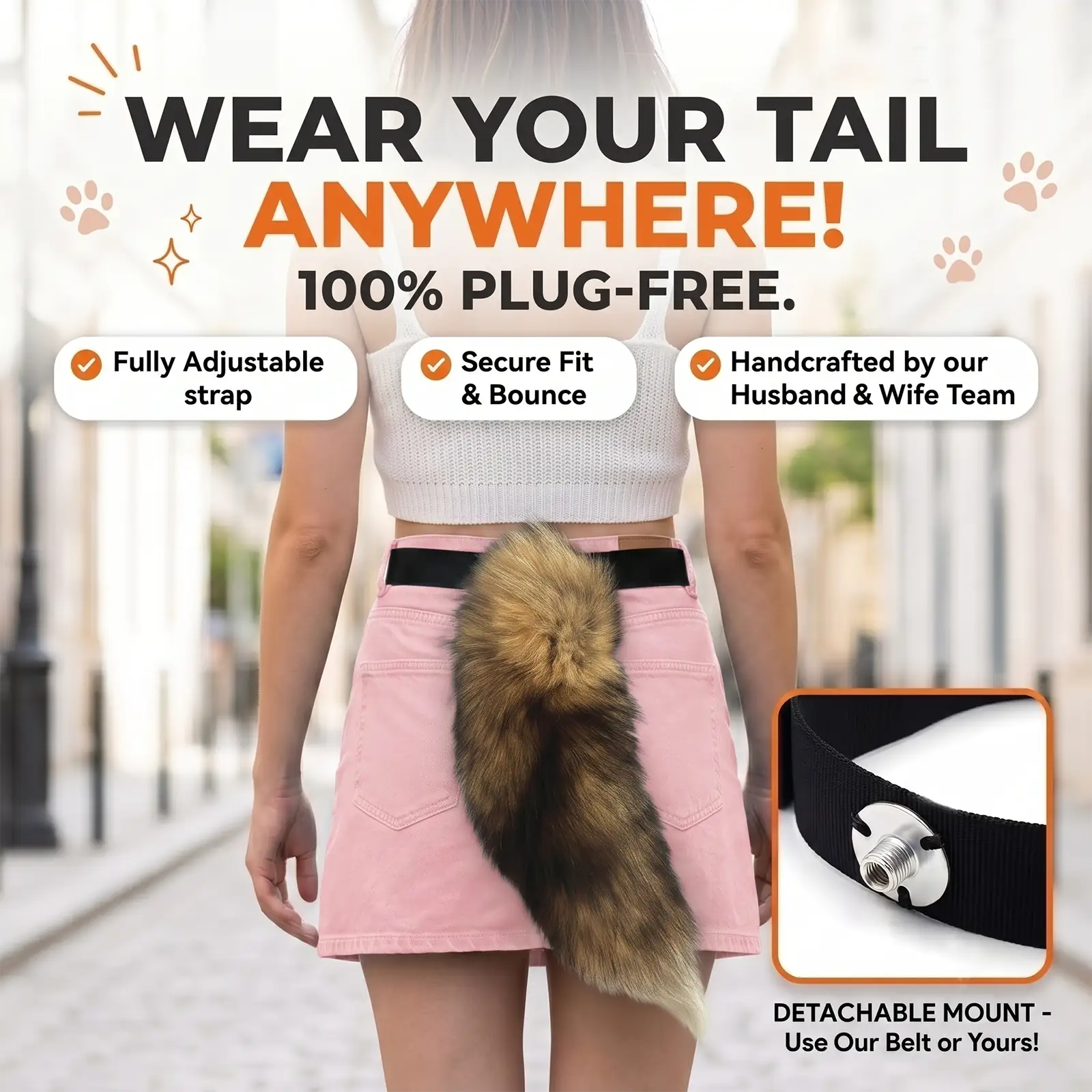 A woman shown from the back wearing a pink skirt and white top, with a brown and black faux-fur tail accessory attached to a black belt. Large promotional text reads 'WEAR YOUR TAIL ANYWHERE! 100% PLUG-FREE.