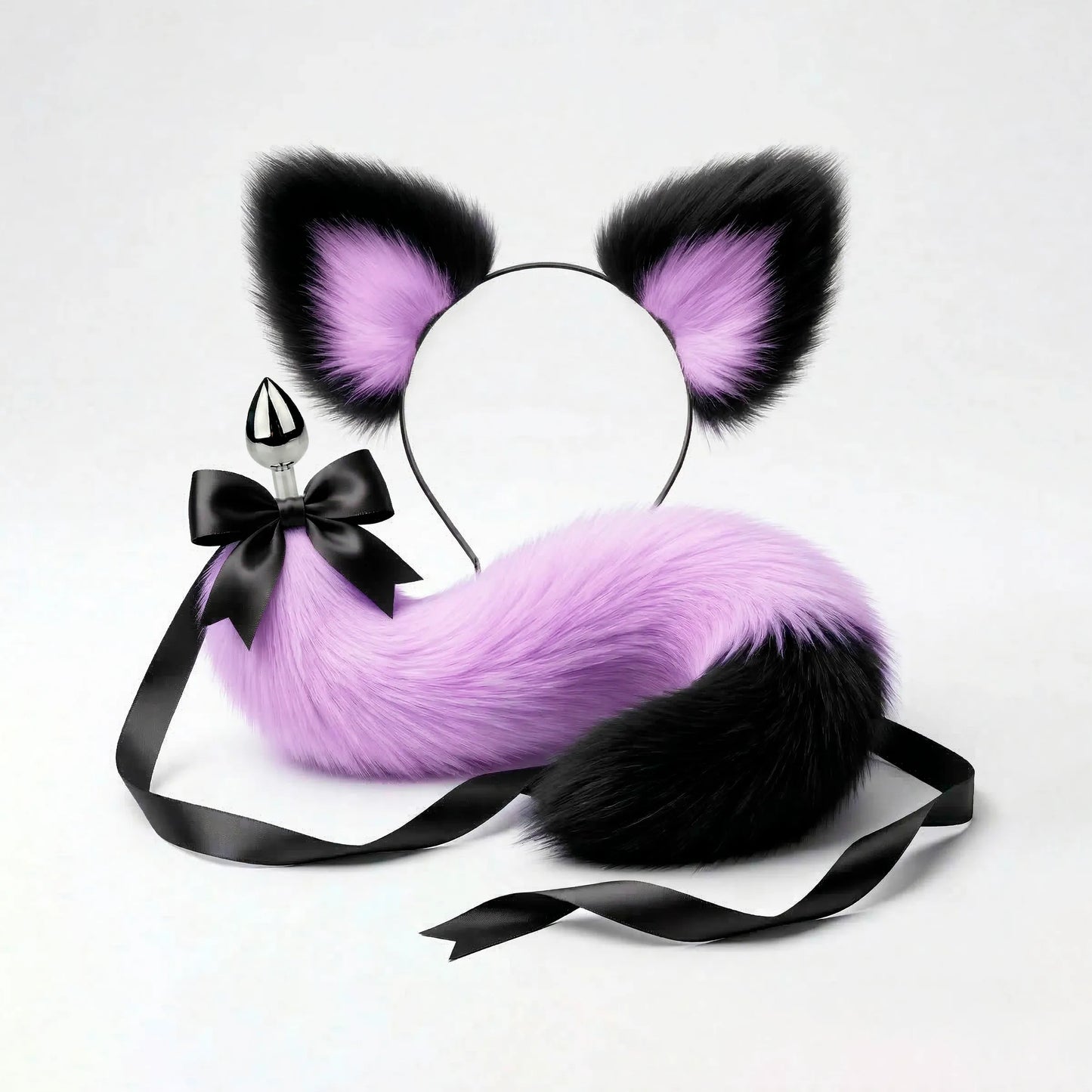 Furry faux fur purple and black cat tail butt plug and ears with a bow on a white background