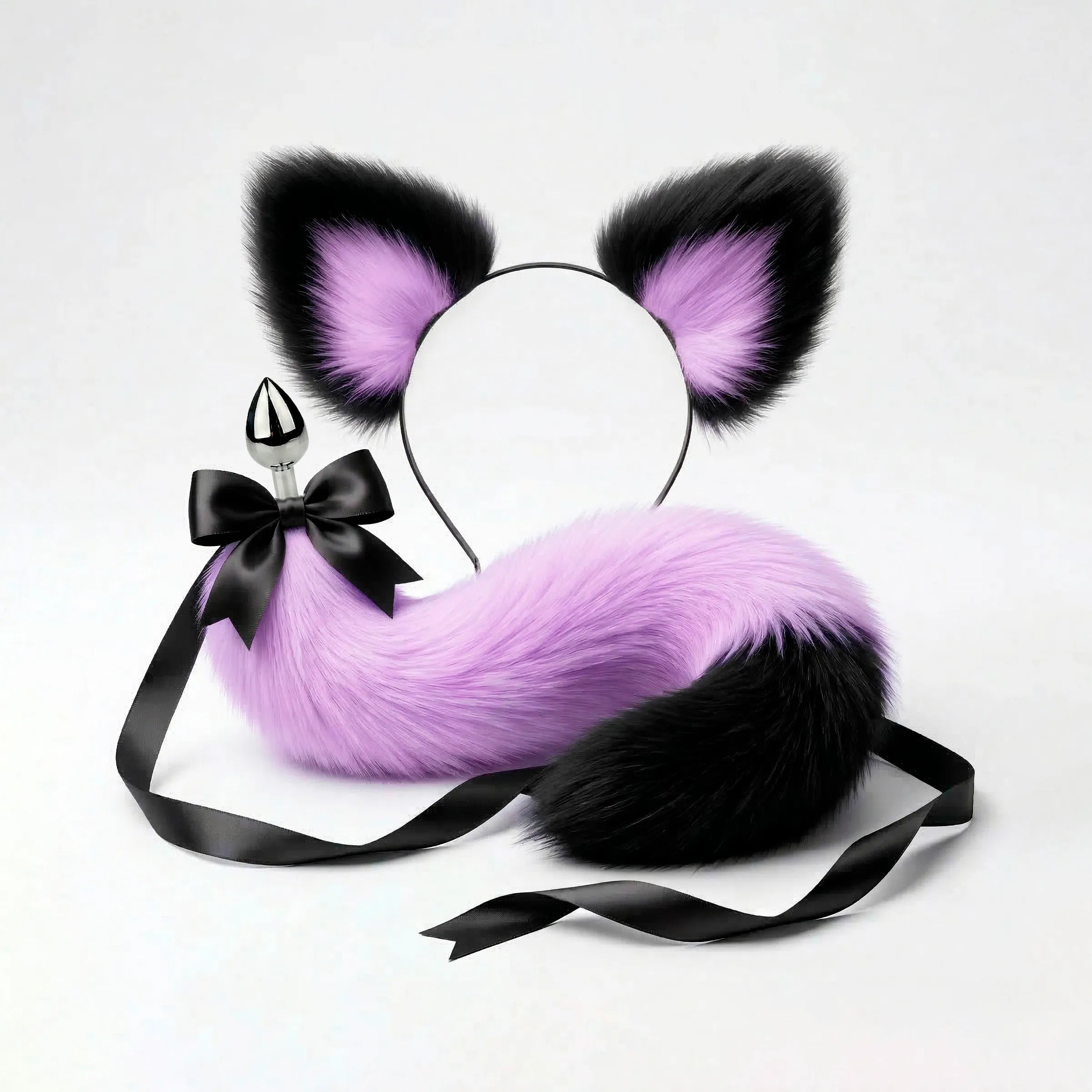 Furry faux fur purple and black cat tail butt plug and ears with a bow on a white background