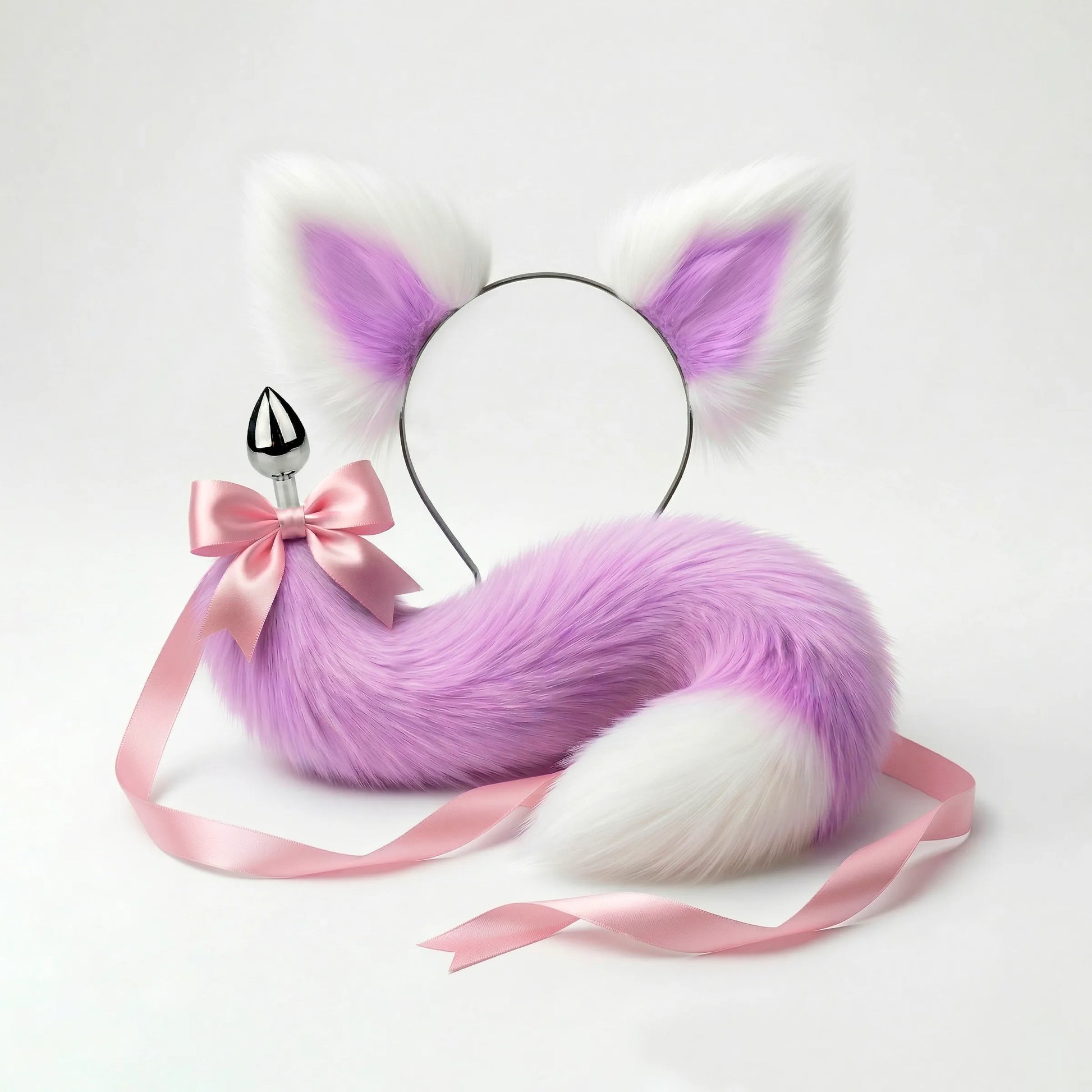 Furry faux fur purple and white cat tail butt plug and ears with a bow on a white background