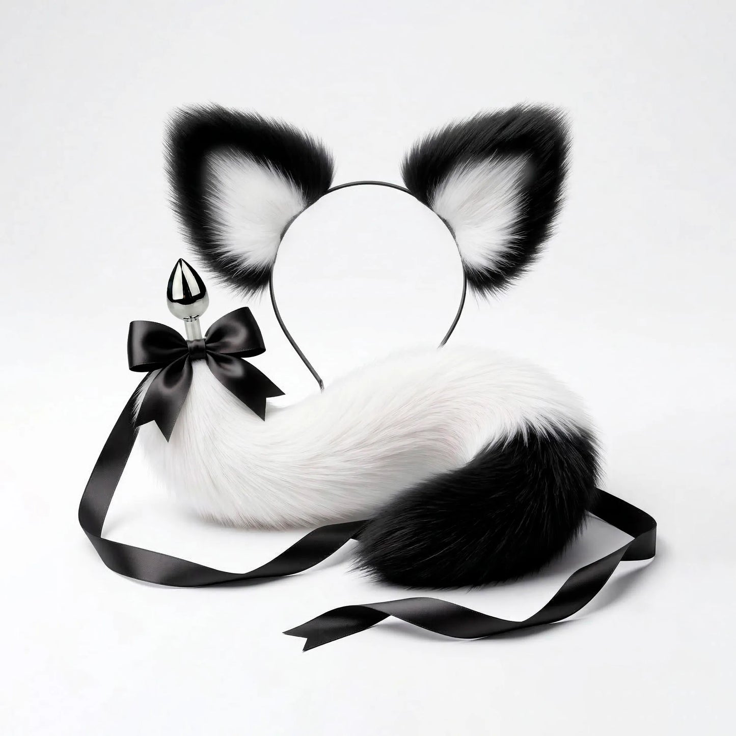 Furry faux fur white and black cat tail butt plug and ears with a bow on a white background