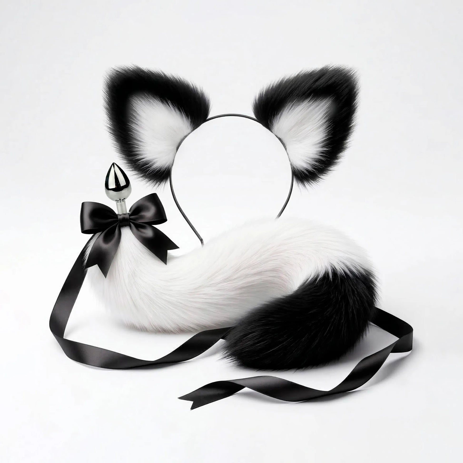 Furry faux fur white and black cat tail butt plug and ears with a bow on a white background