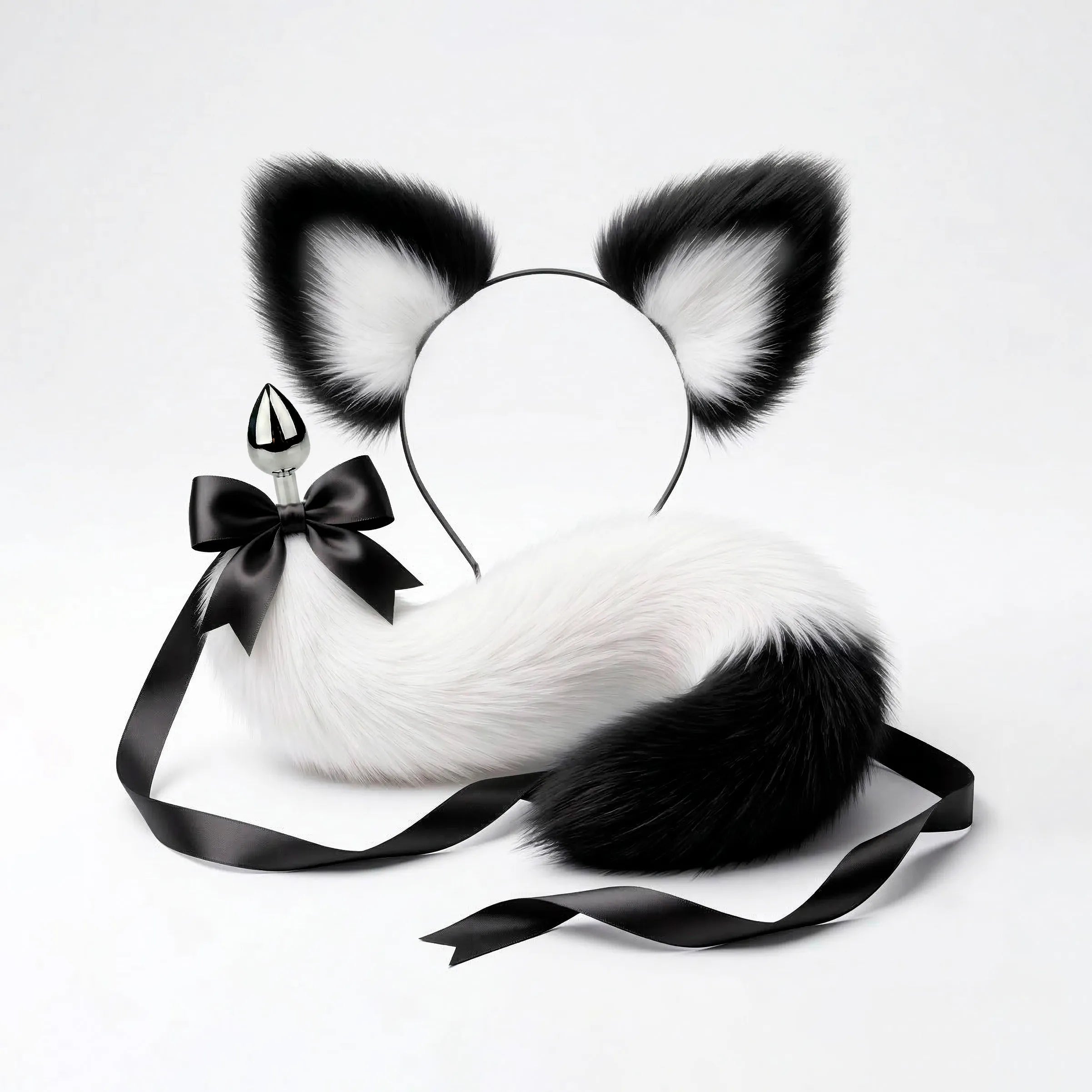 Furry faux fur white and black cat tail butt plug and ears with a bow on a white background